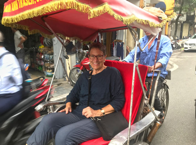 Our Client on cyclo in Hanoi Old Quarter