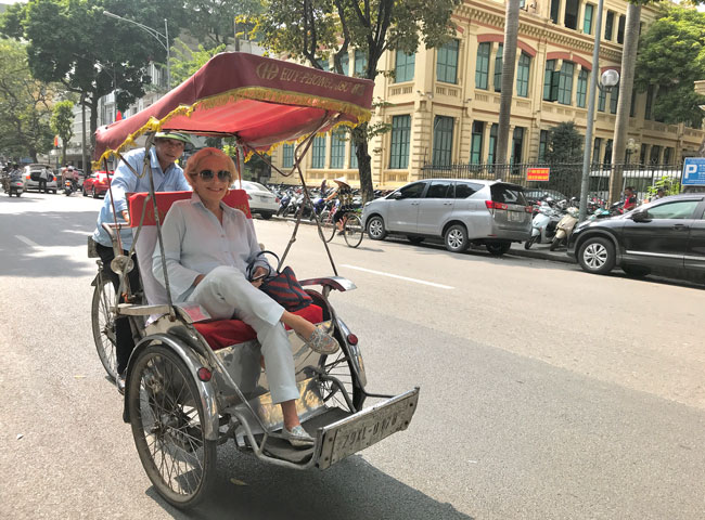 Traveler on Cyclo in Hanoi
