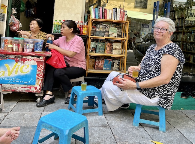 Sitting on sidewalk for tea in Hanoi