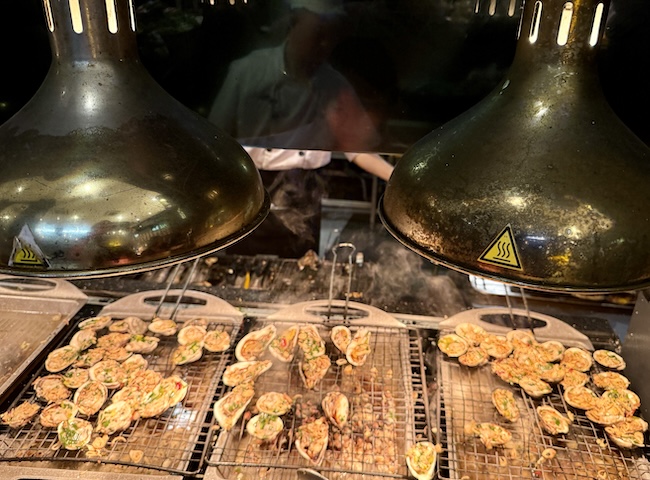 Grilling oysters at Maison Sen