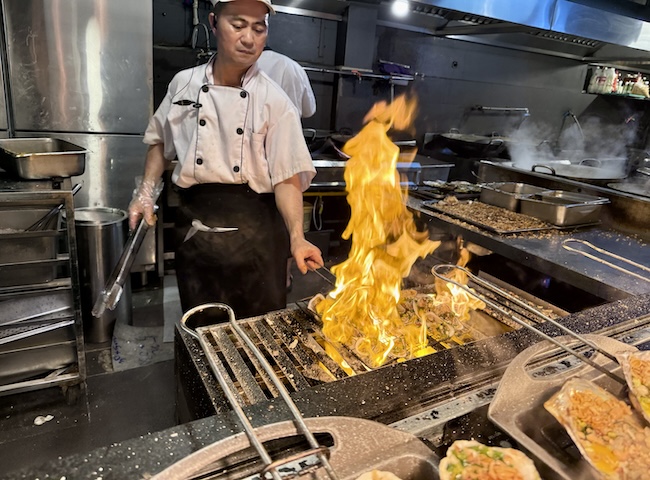 Grilling seafood at Maison Sen